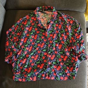 Cherry dressy shirt cut shirt with short sleeves.